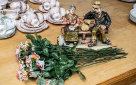 Capodimonte 'Old Couple' Figurine, depicting an elderly lady and man on a bench, signed to base