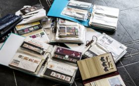 A Quantity of Stamp Albums Containing Royal Mail Presentation Packs and First Aid Covers.