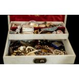 Collection of Costume Jewellery, housed in a two tier cream jewellery box, including brooches,