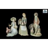 A Collection of Three Lladro Figures to include 4814 Girl With Turkey (#4814) Height 10 inches,