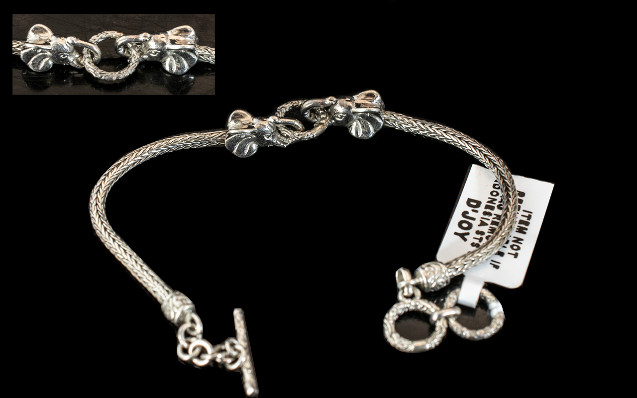 A Modern Silver Bracelet With Central Elephant Head Links