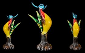 Murano Glass Bird Figure, raised on an amber glass base, overall size 13".