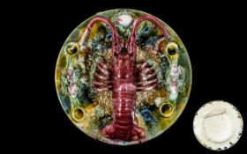 Majollica Lobster Plate, Portuguese, with a lobster surrounded by coral and leaf decoration.