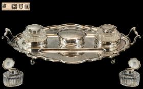 A Large Silver Twin Handled Desk Tidy of scalloped molded form with 2 wells,