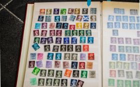 Red A4 stock book of British stamps. Lots of Machins, some Wildings, regionals, to pays and