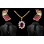 Ladies 18ct Gold Attractive Ruby and Diamond Set Pendant - In Flower head Design.