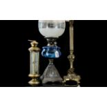 Large Victorian Oil Lamp with patterned metal pedestal, blue glass middle and white globe top.