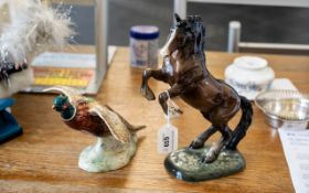 Two Beswick Figures, comprising a rearing horse figure No.