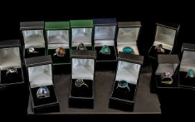 Collection of Twelve Silver Dress Rings, set with coloured crystals, stones, pearls, etc.