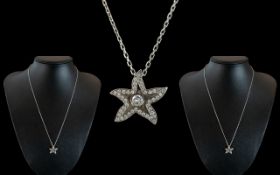 18ct White Gold Diamond Set Star Pendant with Attached 18ct White Gold Chain.
