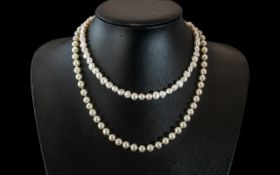 Two Pearl Necklaces, a 16" freshwater pearl necklace, and a 20" pearl necklace with a screw fitting.