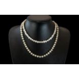 Two Pearl Necklaces, a 16" freshwater pearl necklace, and a 20" pearl necklace with a screw fitting.