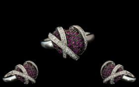 18ct White Gold - Contemporary Designed Ruby and Diamond Set Dress Ring. Marked 18ct to Interior