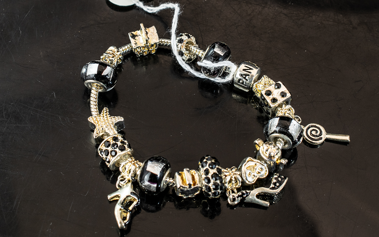 Pandora Style Charm Bracelet, in a Pandora box, filled with charms including dice, starfish, high