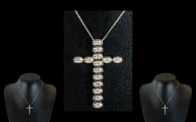 An 18ct Gold Cross Each Hinged Link Set with a Round Modern Brilliant Cut Diamond,