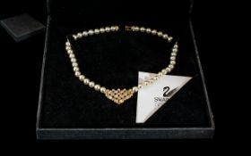 Swarovski Pearl Necklace, with crystal centre heart, in original fitted box.