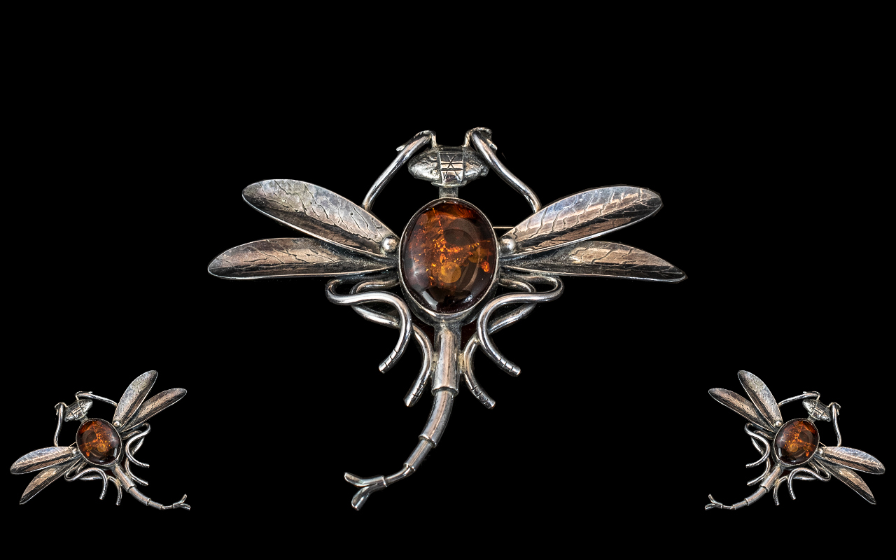 Large Dragonfly Brooch, white metal set with an oval amber stone.