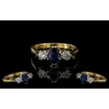 Ladies 18ct Gold - Attractive 3 Stone Diamond and Sapphire Set Dress Ring.