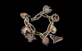 A Good Quality Vintage Sterling Silver Charm Bracelet - Loaded with 7 Good Charms,