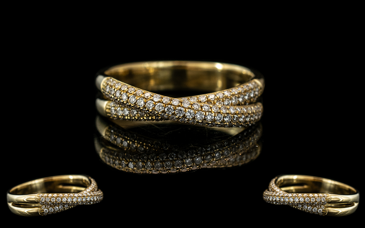 An 18ct Gold Diamond Ring Two Rows of Round Modern Brilliant Cut Diamonds Set on a Twist.