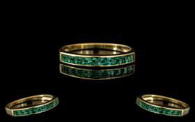 A 14ct Gold Emerald Half Eternity Ring stamped 585. Ring size P.