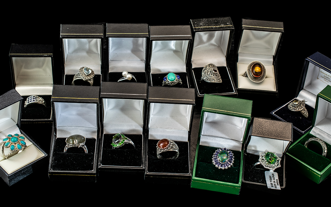 Collection of Fourteen Silver Dress Rings, set with coloured crystals, stones, pearls, etc.