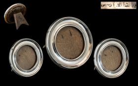 A Fine Trio of Sterling Silver Photo Frames of Circular Shape with Oak backs. Makers Mark T.H.H.
