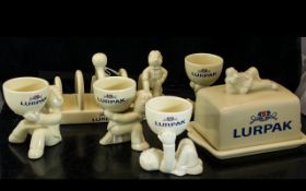 Collection of Lurpak Kitchen Ware, comprising a toast rack, butter dish and four egg cups.