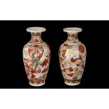A Pair of Kutani 10" vases, decorated with figures in a garden. Unmarked.