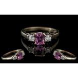 18ct White Gold - Attractive 3 Stone Pink Sapphire and Diamond Set Dress Ring.