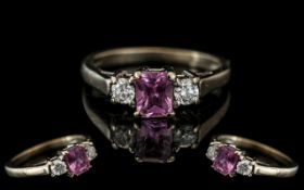 18ct White Gold - Attractive 3 Stone Pink Sapphire and Diamond Set Dress Ring.
