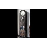 An Art Deco Long Cased Clock with silver