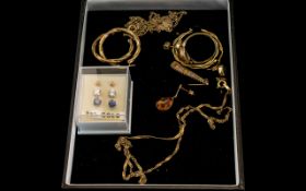 Small Collection of Gold Jewellery, comprising gold hoop earrings, an amber set ring,