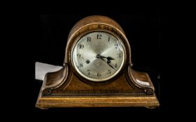 An Oak Cased Napoleon Hat Mantle Clock plus one other.