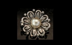 18ct White Gold Diamond Pearl Flower Brooch Central Pearl Surrounded By Round Cut Diamonds.