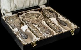 Silver Dressing Table Set, comprising a mirror, two hairbrushes, comb, and two clothes brushes,