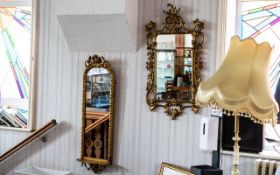 Two Gilt Framed Mirrors, comprising a wall mirror with ornate gilt frame, measures 42" x 22",