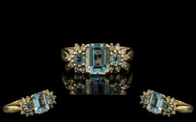 18 Ct Gold Attractive Aquamarine Diamond Set Dress Ring fully hallmarked to interior of shank.