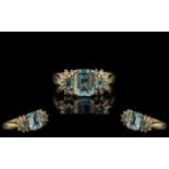 18 Ct Gold Attractive Aquamarine Diamond Set Dress Ring fully hallmarked to interior of shank.