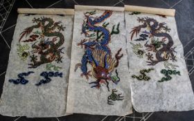 Three Oriental Decorative Wall Hangings, on paper with stylised clouds, vapours, dragons, etc.