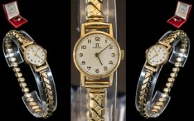 Omega - Ladies 9ct Gold Cased Mechanical Wrist Watch with Attached Gold Plated Expanding Bracelet.