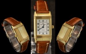 Jaeger-le-Coultre Ladies 18ct Gold Reverso Wrist Watch with Tan Leather Strap.