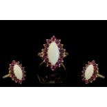 Ladies 9ct Gold Attractive Opal and Ruby Set Dress Ring. Full Hallmark to Interior of Shank.