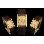 Omega - Deville Slim line Gold Plated Wrist Watch of Rectangular Form with Attached Leather Strap.