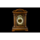 An Early 20thC Oak Cased Striking Clock carved decoration, cream chapter dial with Arabic numerals,