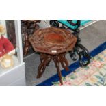 Small Octagonal Oriental Dragon Table, raised on four carved dragon legs, diameter 17", height 17".