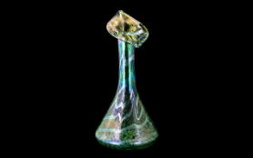 Art Nouveau Ditchfield Style Vase, tulip shaped top, in green lustre effect, measures 14" tall.