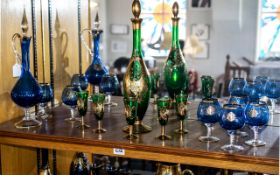 Collection of Coloured Venetian Glass, comprising a 15'' tall blue and gilt decanter with six