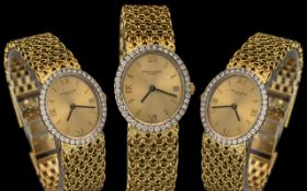 Patek Philippe - Vintage Ladies 18ct Gold and Diamond Set Oval Shaped Wrist Watch.