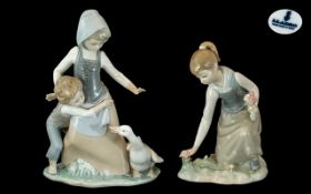 Two Lladro Figurines 'Girl Gathering Flowers' (#1172) 8 inches tall and 'Avoiding the Goose' (#5033)